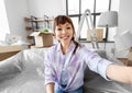 smiling asian woman taking selfie at new home Royalty Free Stock Photo