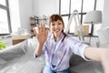 smiling asian woman taking selfie at new home Royalty Free Stock Photo