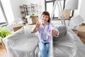 smiling asian woman taking selfie at new home Royalty Free Stock Photo