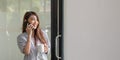 Smiling asian woman talking on the phone at home, happy young girl holds cellphone making answering call, attractive Royalty Free Stock Photo