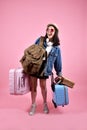 Smiling asian woman traveler carry lot of baggage, Happy tourist girl having cheerful holiday trip, Many luggage.