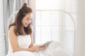 Beautiful girl is doing online shopping on ipad Royalty Free Stock Photo