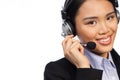 Smiling Asian woman wearing a headset Royalty Free Stock Photo