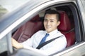 Smiling young business man driving a car Royalty Free Stock Photo