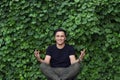 Smiling asian young man posing yoga Royalty Free Stock Photo