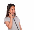 Smiling asiatic young woman conversing on phone