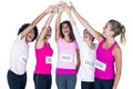 Smiling athletes putting their hands together with arms raised Royalty Free Stock Photo