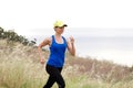 Smiling athletic woman jogging in nature Royalty Free Stock Photo