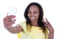 Smiling attractive african woman taking a selfie Royalty Free Stock Photo