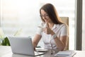 Smiling attractive businesswoman drinking invigorating coffee du