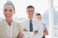 Smiling attractive businesswoman standing with arms crossed Royalty Free Stock Photo