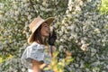 Smiling attractive caucasian woman in retro clothes with straw hat and vintage black lace gloves. Cottagecore. Royalty Free Stock Photo