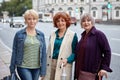 Smiling attractive senior women walk in city center at daytime. Royalty Free Stock Photo