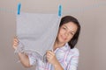 Smiling Attractive Woman Hanging Wet Clean Cloth To Dry On Cloth Royalty Free Stock Photo