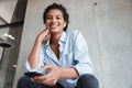 Smiling attractive young african woman wearing shirt Royalty Free Stock Photo