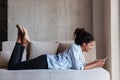 Smiling attractive young african woman wearing shirt relaxing Royalty Free Stock Photo