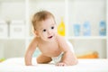 Smiling baby on all fours in diaper or nappy Royalty Free Stock Photo