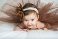 Smiling baby ballerina in brown tutu Royalty Free Stock Photo