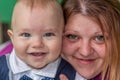 Smiling baby boy and his mother