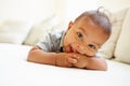 Smiling Baby Boy Lying On Tummy At Home Royalty Free Stock Photo