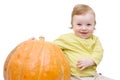 Smiling baby boy playing with pumpkin Royalty Free Stock Photo