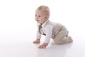 Smiling baby-boy in a romper suit crawling Royalty Free Stock Photo