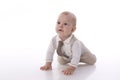 Smiling baby-boy in a romper suit crawling Royalty Free Stock Photo