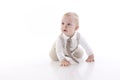 Smiling baby-boy in a romper suit crawling Royalty Free Stock Photo