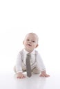 Smiling baby-boy in a romper suit crawling Royalty Free Stock Photo