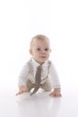 Smiling baby-boy in a romper suit crawling Royalty Free Stock Photo