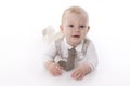 Smiling baby-boy in a romper suit crawling Royalty Free Stock Photo