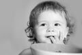 Smiling baby eating food. Healthy nutrition for kids. Funny child face closeup. Royalty Free Stock Photo