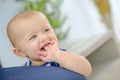Smiling baby with fingers in mouth Royalty Free Stock Photo