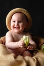 Smiling baby with flower Royalty Free Stock Photo