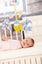 Smiling baby girl in bed Royalty Free Stock Photo