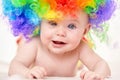 Smiling baby girl with colorful wig Royalty Free Stock Photo