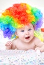 Smiling baby girl with colorful wig Royalty Free Stock Photo