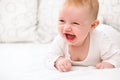 Smiling Baby Girl are Lying in the Bed Royalty Free Stock Photo