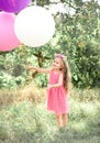 Smiling baby girl playing with balloons Royalty Free Stock Photo