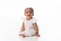 Smiling Baby Girl Wearing a White Dress Royalty Free Stock Photo