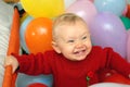 Smiling baby with globes Royalty Free Stock Photo