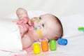 Smiling baby with paper and finger-type paints Royalty Free Stock Photo