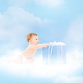 Smiling baby with present on the cloud Royalty Free Stock Photo