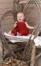 Smiling Baby in Red Overalls Royalty Free Stock Photo