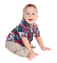 Smiling baby sitting on the floor Royalty Free Stock Photo