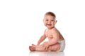 Smiling baby sitting on floor over white copyspace Royalty Free Stock Photo