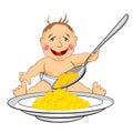 Smiling baby which eats with a spoon porridge