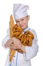 Smiling baker with bread and bagels