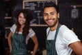 Smiling baristas looking at the camera Royalty Free Stock Photo