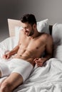 Bearded handsome sexy man lying on